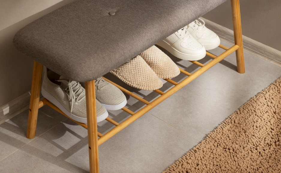 Several pairs of sneakers on a shoe rack