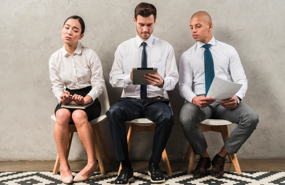 Three people wearing business attire