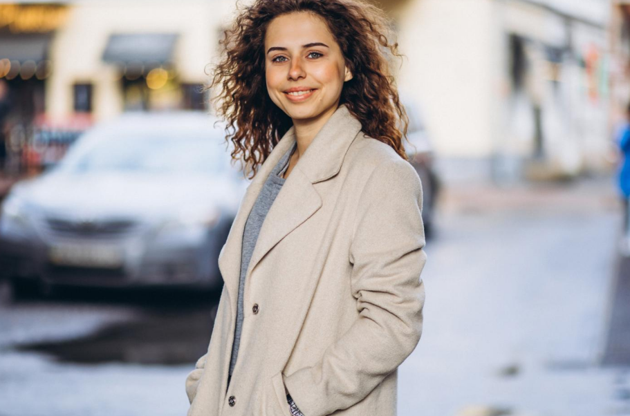a woman is walking on the street