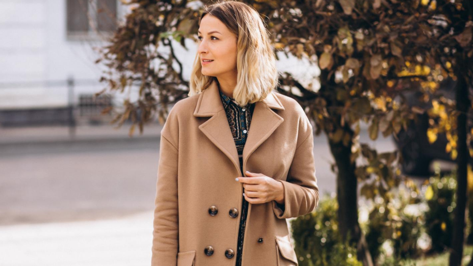 a woman is walking on the street