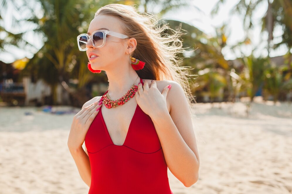 young beautiful blond woman sunbathing beach red swimming suit sunglasses 285396 6416